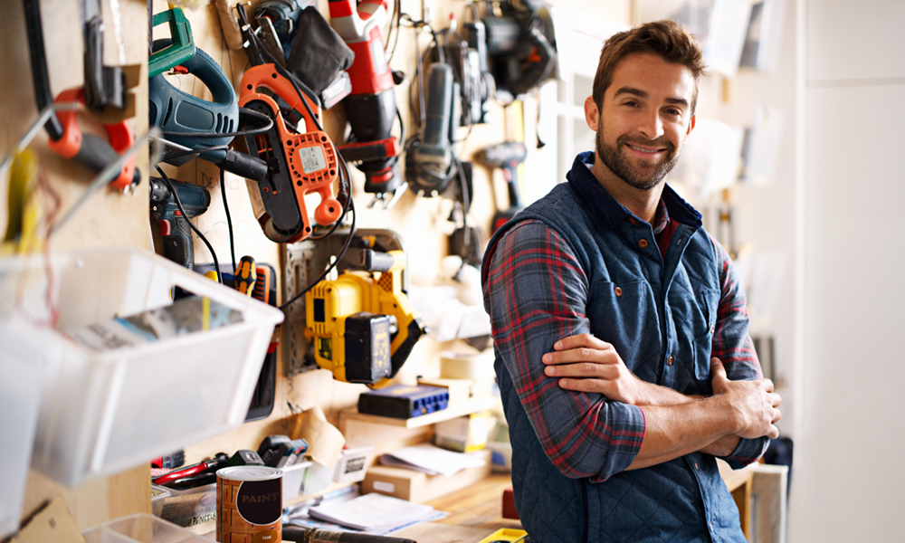 Man standing in front of tool bench